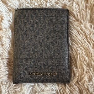 Michael Kors Jet Set Travel passport wallet in brown signature canvas